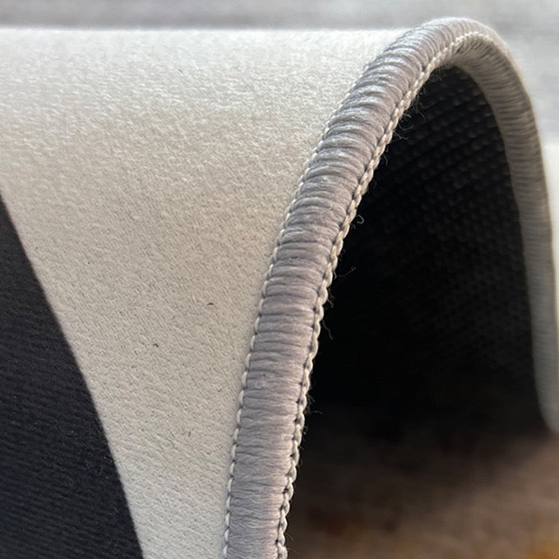 Close-up of rug surface, bound edge and textured backing
